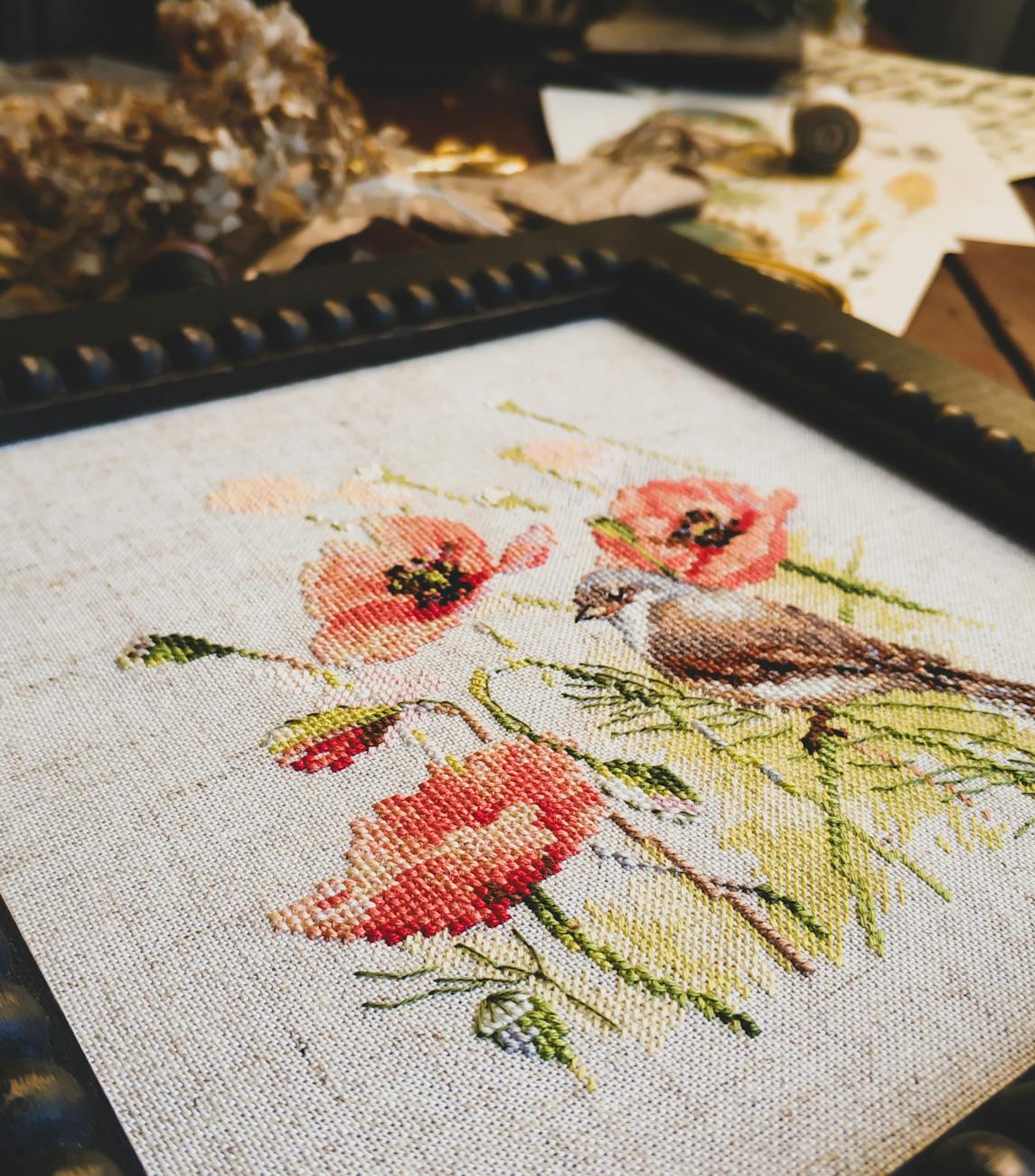 close up photo of embroided poppy flowers