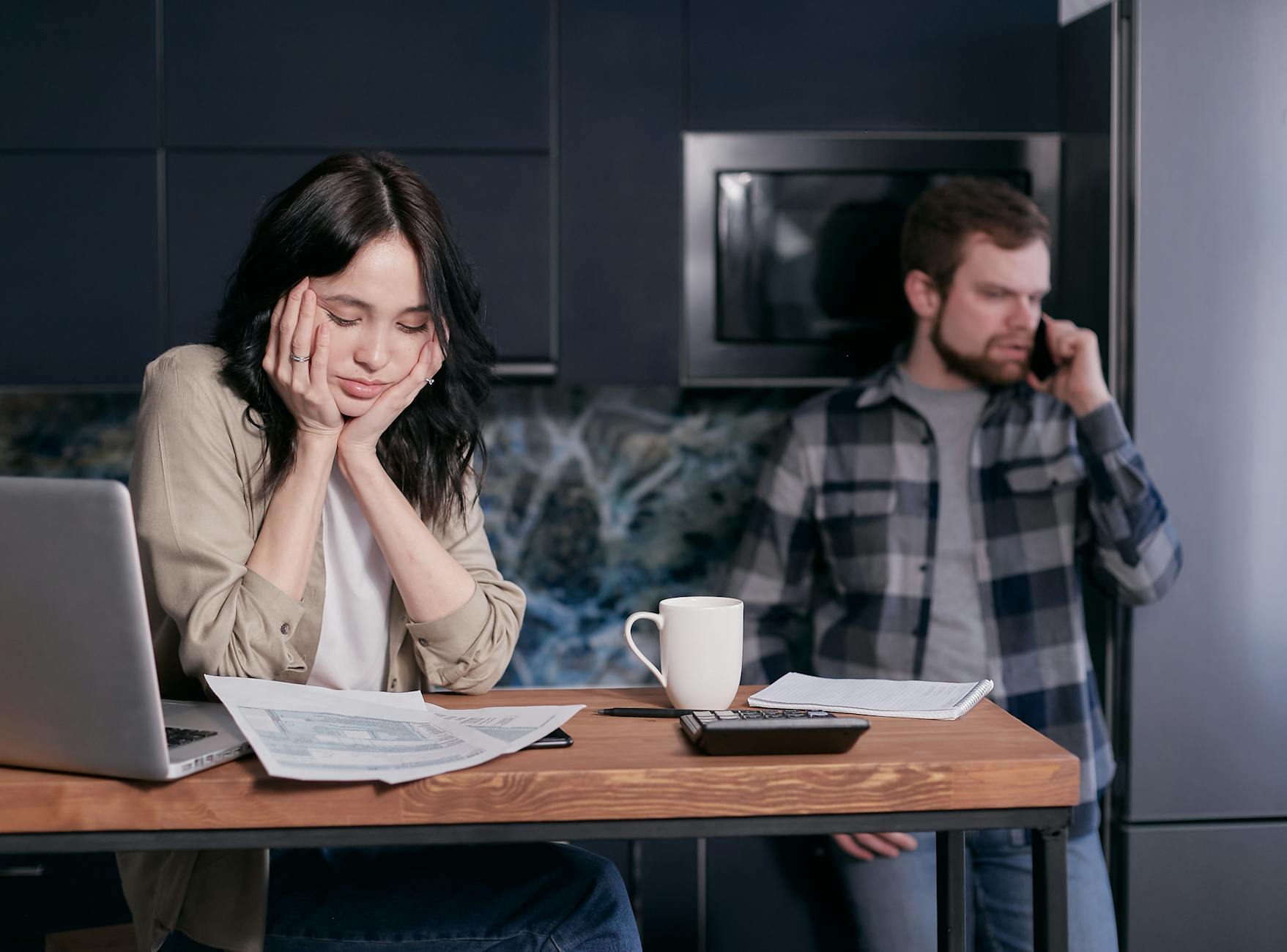 woman in white long sleeve shirt sitting beside man in black and white checkered dress shirt