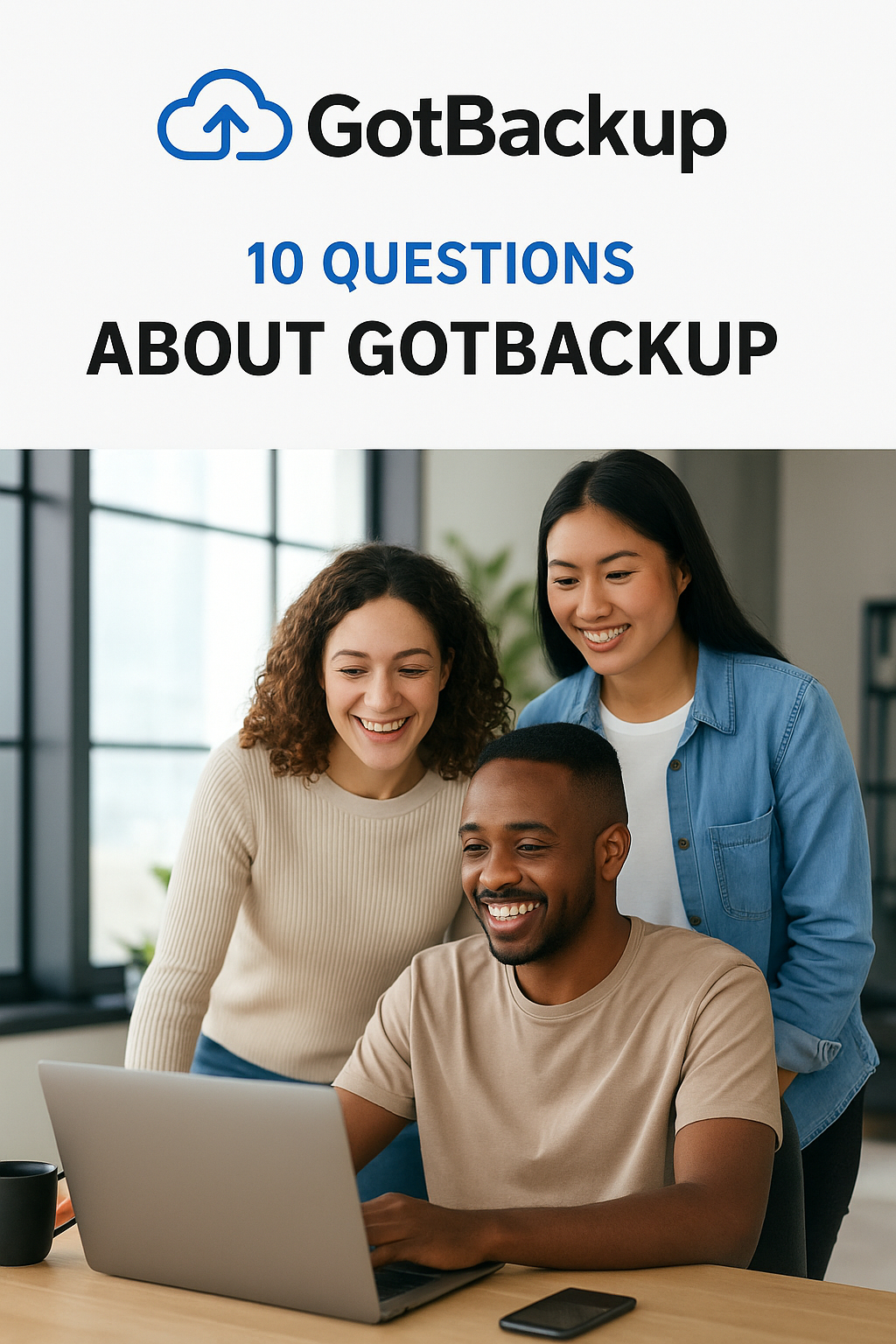 Three diverse professionals smiling while looking at a laptop, symbolizing teamwork and technology, with GotBackup FAQ title above.